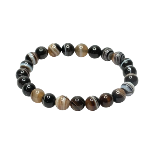 Sulemani Hakik bracelet with black, brown, and white crystals on a white background