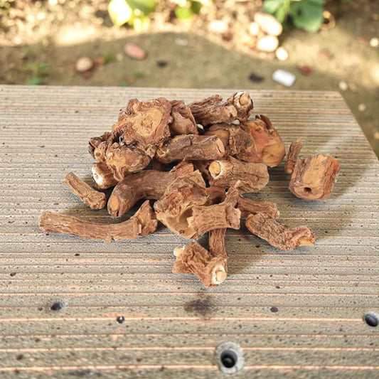 Dried anant mool jad roots on a wooden surface 