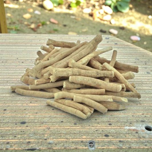 Stack of ashwagandha jad on a wooden surface.
