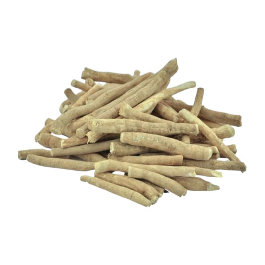 Stack of dried ashwagandha roots sticks on a white background